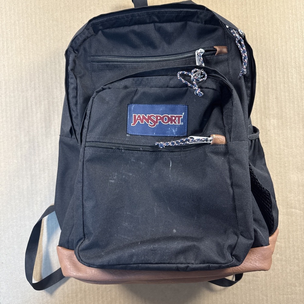 JanSport College Student Backpack Black/Brown Synthetic Leather Bottom